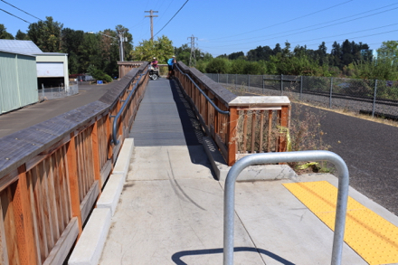 Ramp and bike rack lead to a viewing platform above Springwater Corridor Trail